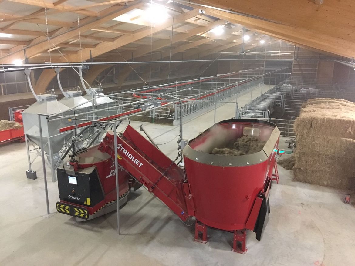 This-feeding-robot-consists-of-a-feed-storage-or-feed-kitchen-with-a-stationary-feed-mixer